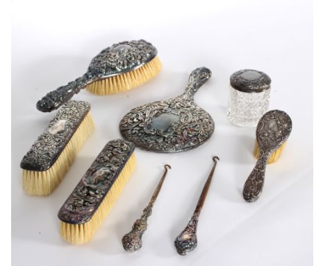 A matched silver backed dressing table set, various makers, comprising hairbrush, child's hairbrush, a pair of clothes brushe