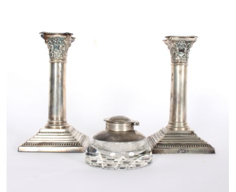 A pair of silver desk candlesticks, Martin & Hall, Sheffield 1911, of Corinthian column form, weighted, 16cm high, a pair of 