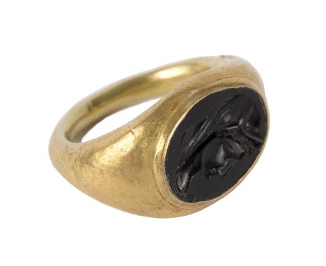 A Roman gold intaglio ring, the carved intaglio depicting the head of a classical male, approximately 4.3gm, approximate size