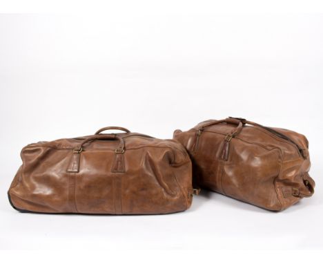 Two brown leather travel bags, by Pickett, London, both with wheels, and a Seisser & Cie brown leather briefcase   Condition 