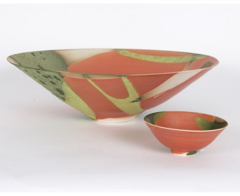 Suzanne Bergne (British, born 1939)/Large ceramic shallow bowl/glazed in orange, green and cream, 42cm diameter and a smaller