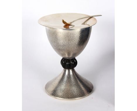A Portuguese 916 standard silver chalice and paten, marked Titulc, of hammered form with gadrooned ebony knop, the chalice 17