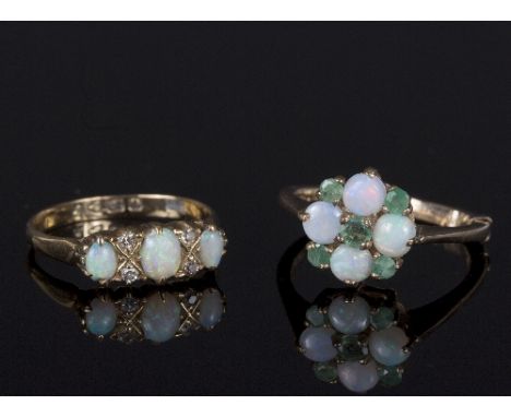 An opal and diamond dress ring, set three oval cabochon opals with four round brilliant cut diamonds to an 18ct gold gypsy st