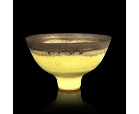 Dame Lucie Rie (Austrian/British 1902-1995) A stoneware footed bowl with yellow glaze and bronzed manganese rim, impressed wi