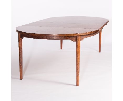 Johannes Andersen for Schou Andersen SVA Møbler/A Danish rosewood dining table, with two extra leaves, 228cm extended and six