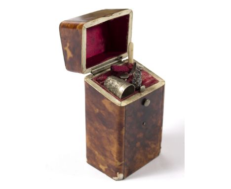 A 19th Century tortoiseshell necessaire, the hinged cover enclosing a fitted interior containing a thimble, button hook, etc.