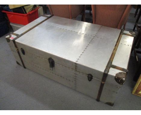 A modern coffee table in the form of a trunk 16"h x 48"w 