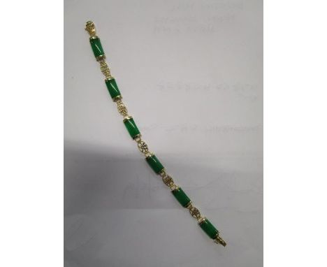 A 14k yellow gold and green jade Chinese bracelet 