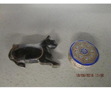 A small continental silver and enamel pill box and a cat snuff box 