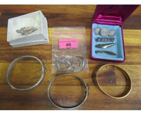 A selection of silver and costume jewellery to include two silver and a 9ct gold a 9ct gold with silver core bangle, a Victor