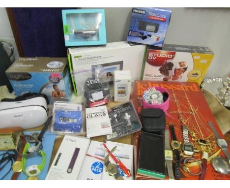 A selection of electricals, some boxed to include a 7" digital photo frame, mobile phones, and a pinnacle studio DV version 9