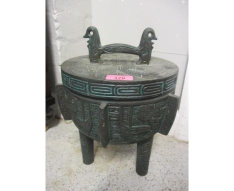 An ice bucket having Mayan inspired designs 