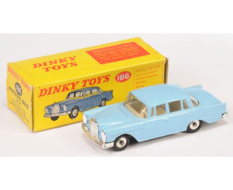 Dinky Toys 186 Mercedes 220SE - Light Blue body, chrome trim and spun hubs - Good Plus in a Good to Good Plus yellow and red 
