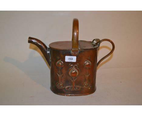 Art Nouveau copper watering can with embossed stylised floral design of tulips marked J.S. and S.B.