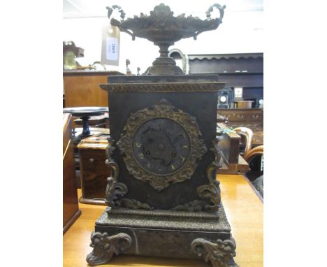 19th Century French black slate and brass mounted mantel clock with circular dial and two train movement striking on a bell, 