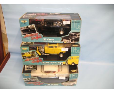 Group of three boxed 1/18th scale models of American muscle cars ' American Graffiti '