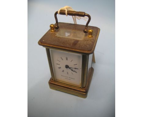 Small brass cased carriage clock with enamel dial and Roman numerals by Matthew Norman, London CONDITION REPORT It does not w