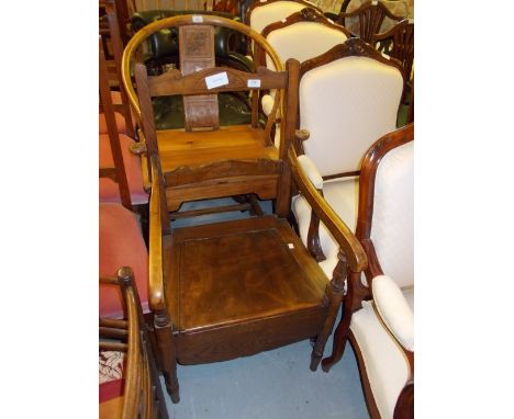 Early 20th Century stained beech commode chair together with a 20th Century fireside chair