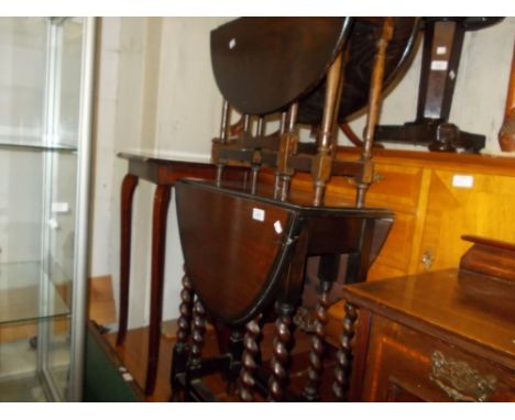 20th Century oak oval gate leg table on barley twist supports together with another smaller stained pine gate leg table