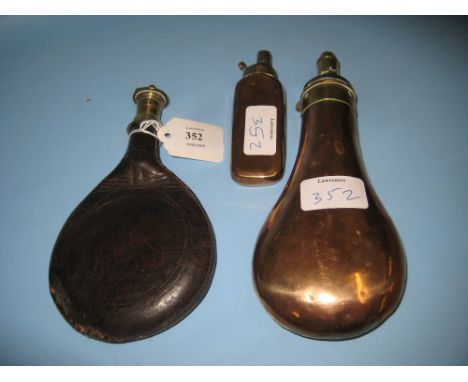 Antique leather shot flask and two similar copper and brass shot flasks