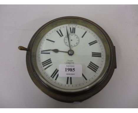 Early 20th Century brass cased ships bulkhead clock, the enamel dial with Roman numerals, signed S. Smith and Son, London, wi