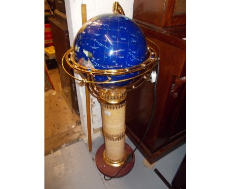 Modern terrestrial globe on a brass gimble with pedestal base