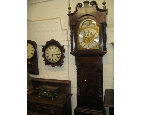 19th Century mahogany longcase clock, the broken arched hood above a Gothic arch door flanked by gilt metal mounted spiral tw