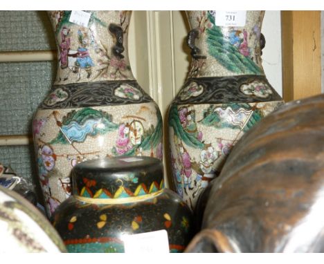 Pair of enamel decorated crackleware baluster form vases decorated with warriors on foot and horseback with impressed charact