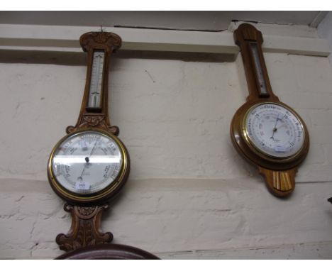 Oak cased wheel barometer / thermometer with floral carved case together with a modern wheel barometer and simulated slate an