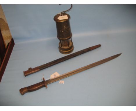 World War I bayonet, Welsh brass miners lamp and a carved bead rosary