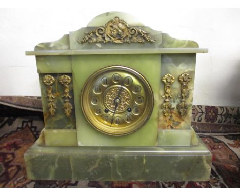Late 19th Century green onyx mantel clock having brass mounts and circular brass dial with Arabic numerals and two train move