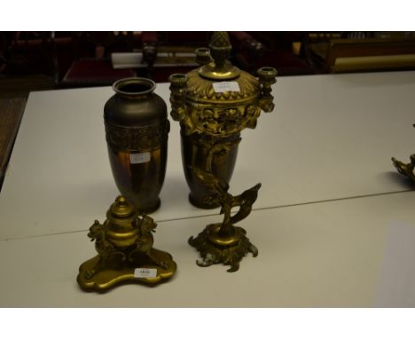Edwardian brass inkstand on gryphon supports together with a pair of early 20th Century embossed brass vases and a gilt metal