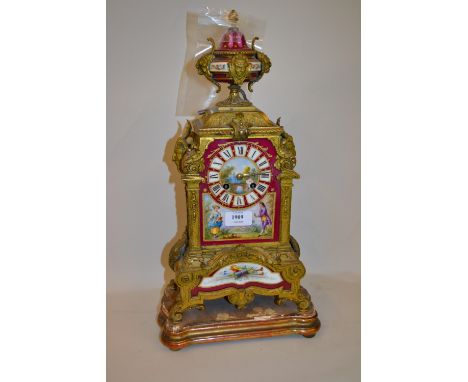 19th Century French gilded spelter and porcelain inset mantel clock with urn surmount, the dial painted with figures in a lan