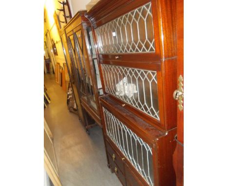 Globe Wernicke type mahogany four section bookcase with leaded glass doors together with a matching narrow bookcase