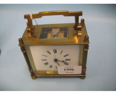 Small rectangular brass cased carriage clock, the enamel dial with Roman numerals (cracked) with a single train movement