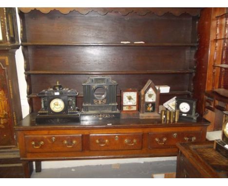 18th Century oak dresser with boarded shelf back above three drawers with brass swan neck handles, raised on cabriole front s