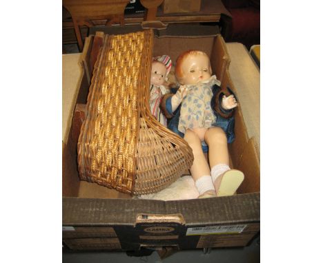 Two 1930's composition dolls by Effanbee, Patsy Ann and Patsy, together with miscellaneous clothing and a cane work cradle (s