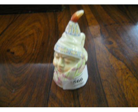 Royal Worcester candle extinguisher in the form of a figure wrapped in a shawl
