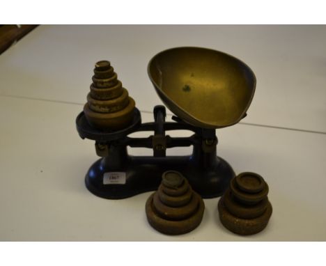 Pair of black painted and brass kitchen scales with set of iron weights and a quantity of various other kitchen weights