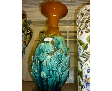 Linthorpe pottery baluster form vase decorated with grasses and other foliage in high relief in shades of turquoise blue and 