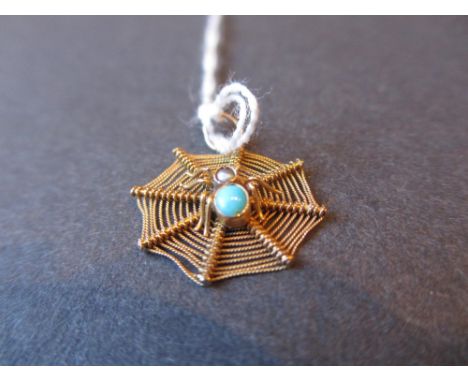Gold, turquoise and seed pearl set pendant in the form of a spiders web