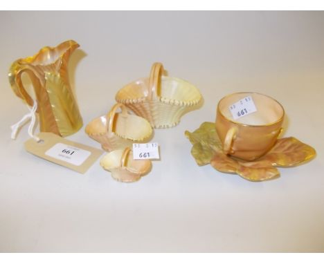 Royal Worcester Foliage pattern cup and saucer, graduated set of three blush ivory baskets and a leaf form jug (some damages)