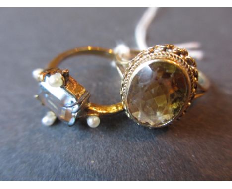 Yellow metal dress ring set blue stone and split pearl, a 9ct gold and citrine ring and another 9ct gold and citrine ring