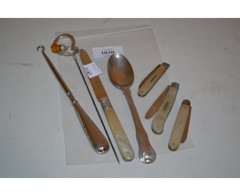 Three silver and mother of pearl folding knives, silver handled button hook, silver teaspoon, silver and mother of pearl knif