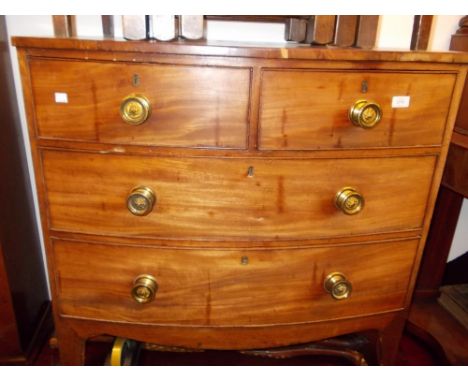 Early 19th Century mahogany bow front chest of two short over two long drawers with brass knob handles on splay supports