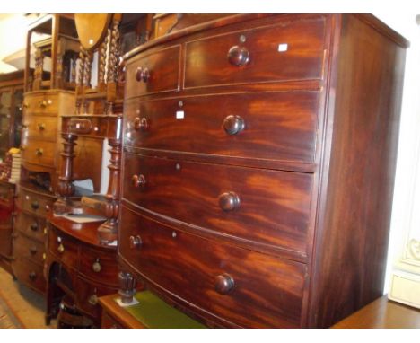 19th Century mahogany bow front chest of two short and three long graduated drawers with knob handles and turned fluted suppo