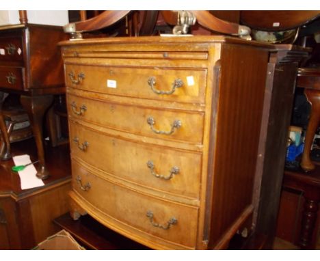 Reproduction mahogany bow fronted chest of four long drawers with brushing slide, raised on bracket feet