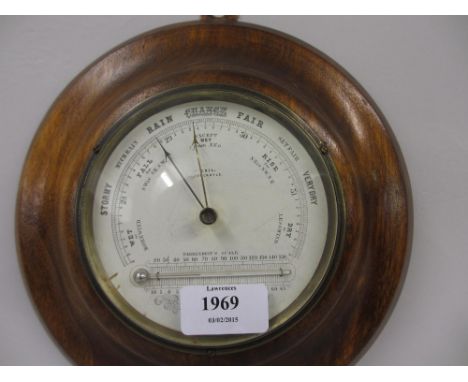 Circular aneroid barometer / thermometer housed in a later wooden case
