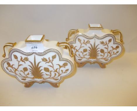 Pair of Worcester vases with stylised floral decoration on gilt and white ground (one handle a/f)