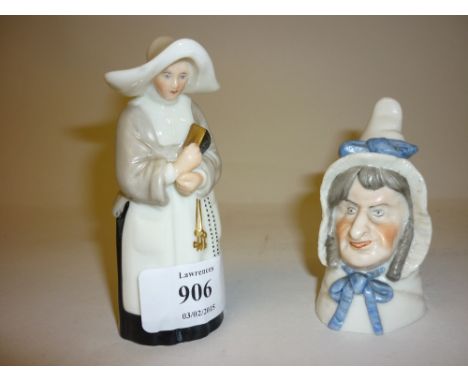 Royal Worcester candle snuffer in the form of a nun (puce mark), together with another candle snuffer in the form of Mrs Caud